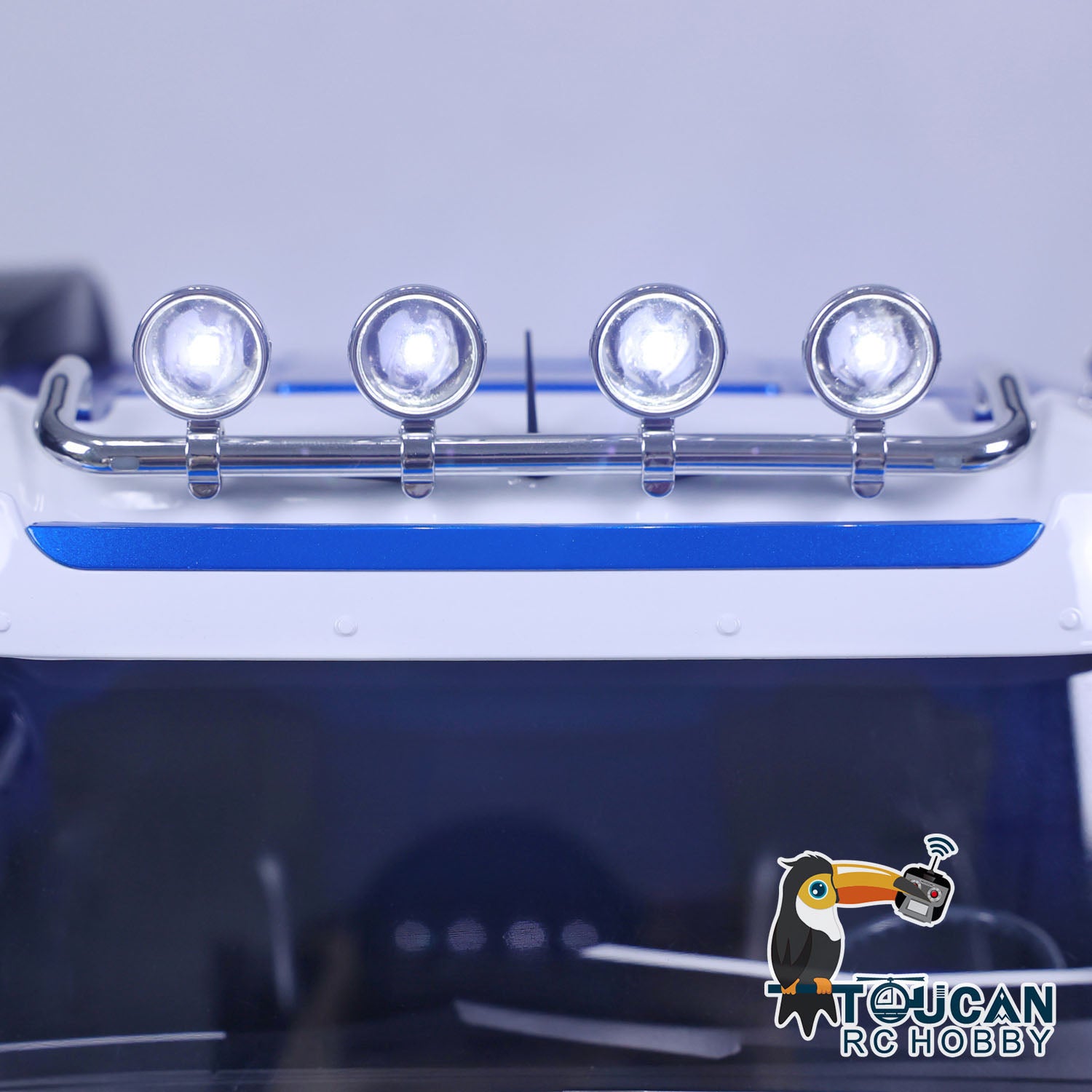 1/14 RC TOUCAN Truck LED headlight system detail with blue front lights and roof light bar
