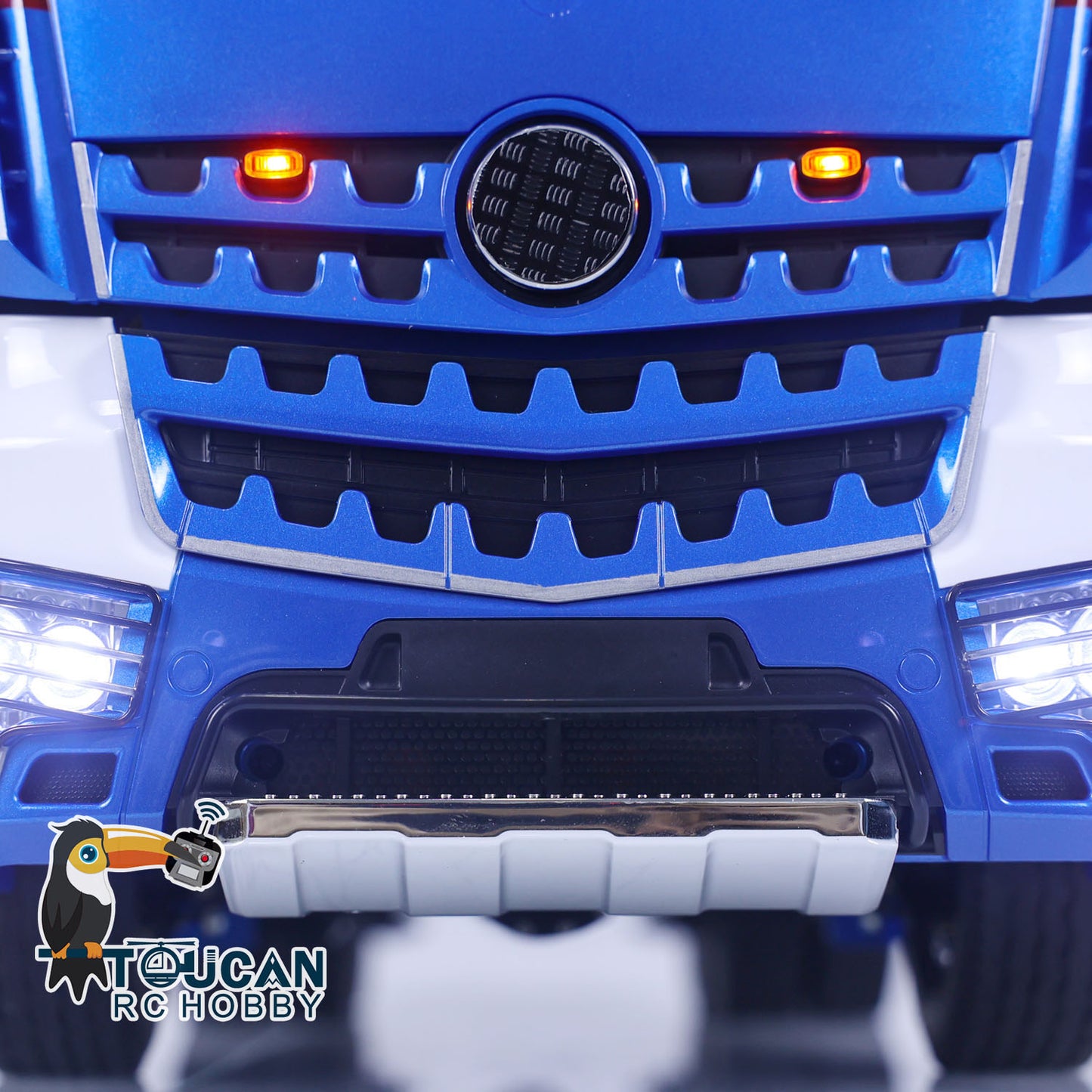 1/14 RC TOUCAN Truck LED headlight system detail with blue front lights and roof light bar
