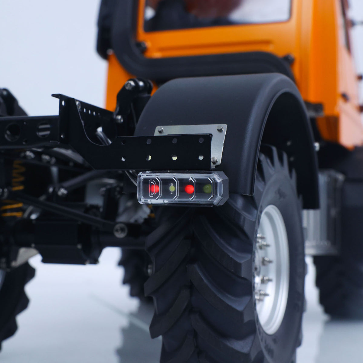 LikeRC U535Lite 1/14 RC 4X4 Off‑Road Truck Orange Rear Fender & Suspension Close‑Up, Rear Wheel Arch & Suspension Component Detail
